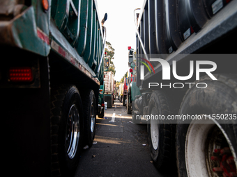 Rows of parked trucks are seen as truckers demonstrate against the increase in diesel prices in Bogota, Colombia, on September 5, 2024. (