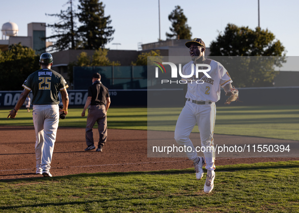 The Yolo High Wheelers celebrate clinching their spot in the 2024 Pioneer Baseball League Playoffs at Dobbins Stadium in Davis, Calif., on S...