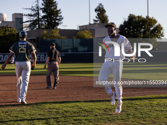 The Yolo High Wheelers celebrate clinching their spot in the 2024 Pioneer Baseball League Playoffs at Dobbins Stadium in Davis, Calif., on S...