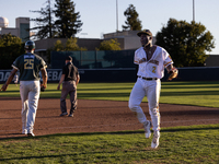 The Yolo High Wheelers celebrate clinching their spot in the 2024 Pioneer Baseball League Playoffs at Dobbins Stadium in Davis, Calif., on S...