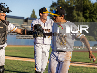 The Yolo High Wheelers celebrate clinching their spot in the 2024 Pioneer Baseball League Playoffs at Dobbins Stadium in Davis, Calif., on S...