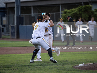 The Yolo High Wheelers celebrate clinching their spot in the 2024 Pioneer Baseball League Playoffs at Dobbins Stadium in Davis, Calif., on S...