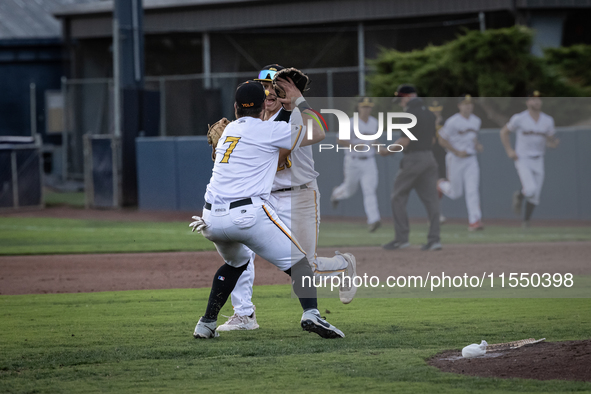 The Yolo High Wheelers celebrate clinching their spot in the 2024 Pioneer Baseball League Playoffs at Dobbins Stadium in Davis, Calif., on S...