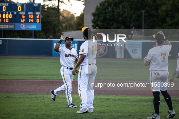 The Yolo High Wheelers celebrate clinching their spot in the 2024 Pioneer Baseball League Playoffs at Dobbins Stadium in Davis, Calif., on S...