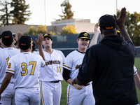 The Yolo High Wheelers celebrate clinching their spot in the 2024 Pioneer Baseball League Playoffs at Dobbins Stadium in Davis, Calif., on S...