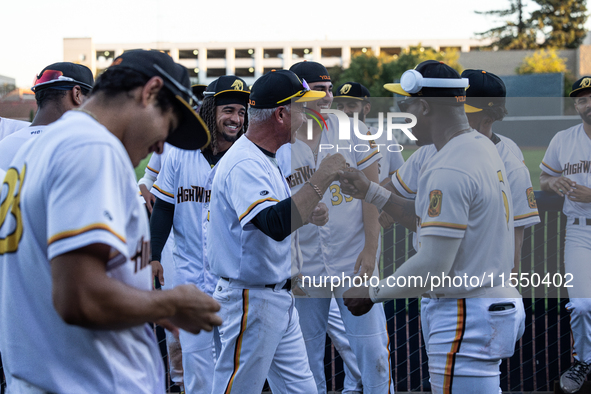 The Yolo High Wheelers celebrate clinching their spot in the 2024 Pioneer Baseball League Playoffs at Dobbins Stadium in Davis, Calif., on S...