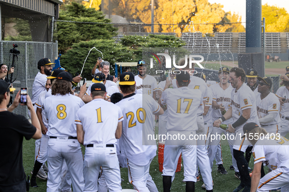 The Yolo High Wheelers celebrate clinching their spot in the 2024 Pioneer Baseball League Playoffs at Dobbins Stadium in Davis, Calif., on S...