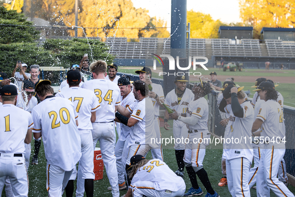 The Yolo High Wheelers celebrate clinching their spot in the 2024 Pioneer Baseball League Playoffs at Dobbins Stadium in Davis, Calif., on S...