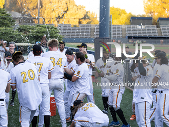 The Yolo High Wheelers celebrate clinching their spot in the 2024 Pioneer Baseball League Playoffs at Dobbins Stadium in Davis, Calif., on S...