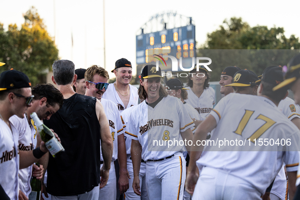 The Yolo High Wheelers celebrate clinching their spot in the 2024 Pioneer Baseball League Playoffs at Dobbins Stadium in Davis, Calif., on S...