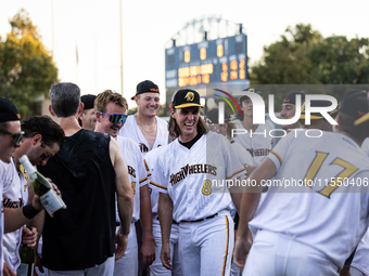 The Yolo High Wheelers celebrate clinching their spot in the 2024 Pioneer Baseball League Playoffs at Dobbins Stadium in Davis, Calif., on S...