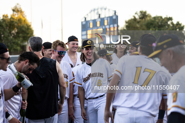 The Yolo High Wheelers celebrate clinching their spot in the 2024 Pioneer Baseball League Playoffs at Dobbins Stadium in Davis, Calif., on S...