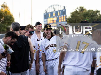 The Yolo High Wheelers celebrate clinching their spot in the 2024 Pioneer Baseball League Playoffs at Dobbins Stadium in Davis, Calif., on S...