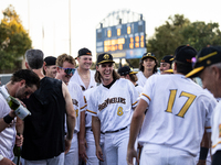 The Yolo High Wheelers celebrate clinching their spot in the 2024 Pioneer Baseball League Playoffs at Dobbins Stadium in Davis, Calif., on S...