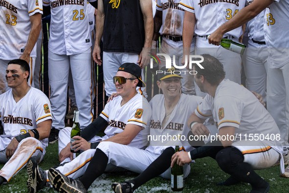 The Yolo High Wheelers celebrate clinching their spot in the 2024 Pioneer Baseball League Playoffs at Dobbins Stadium in Davis, Calif., on S...