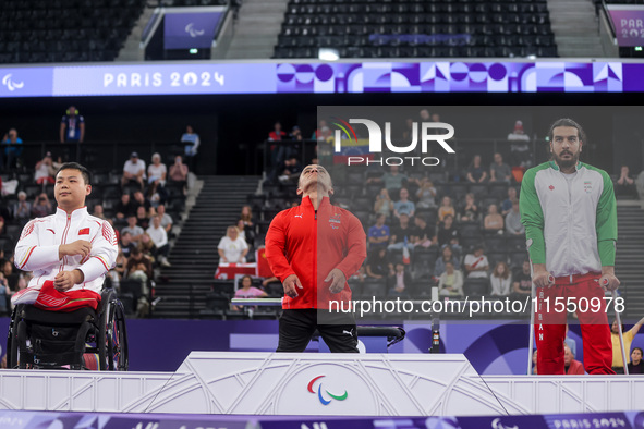 Mohamed Elmenyawy celebrates during the victory ceremony for the para Powerlifting Men's up to 59kg final event at the Paris 2024 Paralympic...