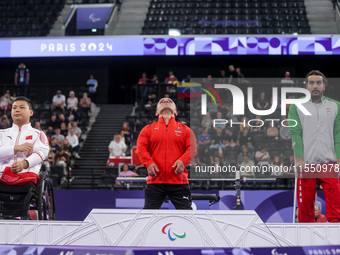 Mohamed Elmenyawy celebrates during the victory ceremony for the para Powerlifting Men's up to 59kg final event at the Paris 2024 Paralympic...