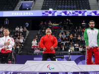 Mohamed Elmenyawy celebrates during the victory ceremony for the para Powerlifting Men's up to 59kg final event at the Paris 2024 Paralympic...