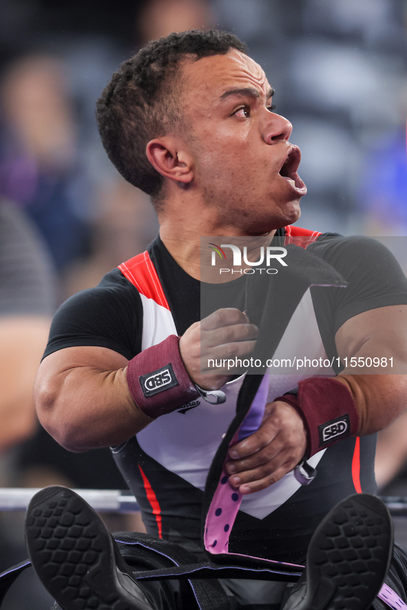 Gold medallist Egypt's Mohamed Elmenyawy celebrates at the end of the para Powerlifting Men's up to 59kg final event at the Paris 2024 Paral...