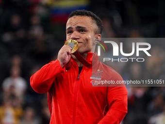 Mohamed Elmenyawy celebrates during the victory ceremony for the para Powerlifting Men's up to 59kg final event at the Paris 2024 Paralympic...