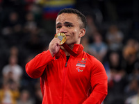 Mohamed Elmenyawy celebrates during the victory ceremony for the para Powerlifting Men's up to 59kg final event at the Paris 2024 Paralympic...