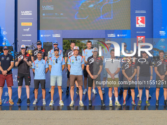 A family faces the ceremonial start during the FIA World Rally Championship WRC EKO Acropolis Rally Greece in Lamia, Greece, on September 5,...