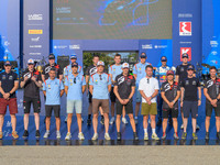 A family faces the ceremonial start during the FIA World Rally Championship WRC EKO Acropolis Rally Greece in Lamia, Greece, on September 5,...