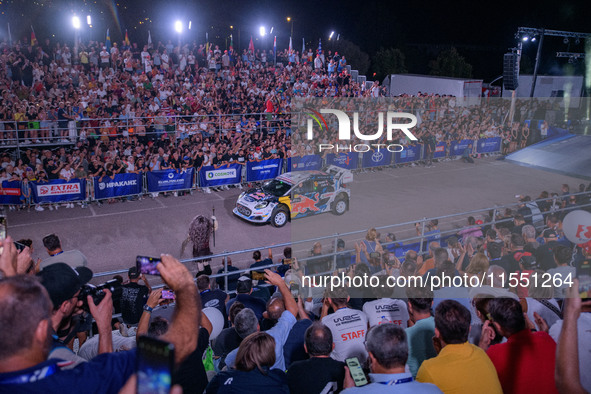 Driver Adrien Fourmaux and co-driver Alexandre Coria of the M-Sport Ford World Rally Team face the ceremonial start in a Ford Puma Rally1 Hy...