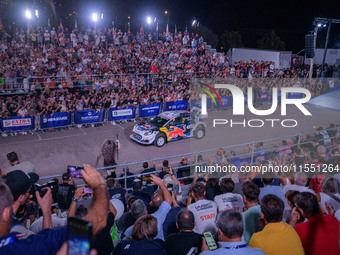 Driver Adrien Fourmaux and co-driver Alexandre Coria of the M-Sport Ford World Rally Team face the ceremonial start in a Ford Puma Rally1 Hy...