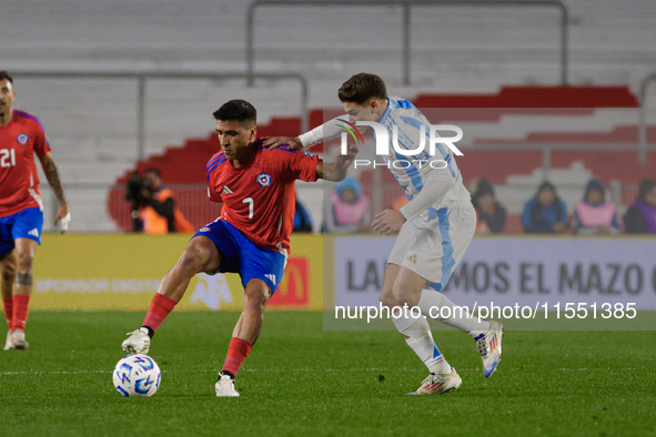 Marcelino Nunez of Chile and Julian Alvarez of Argentina are in action during the FIFA World Cup 2026 Qualifier match between Argentina and...