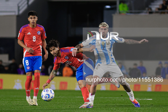 Victor Davila of Chile and Rodrigo de Paul of Argentina are in action during the FIFA World Cup 2026 Qualifier match between Argentina and C...