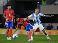 Victor Davila of Chile and Rodrigo de Paul of Argentina are in action during the FIFA World Cup 2026 Qualifier match between Argentina and C...