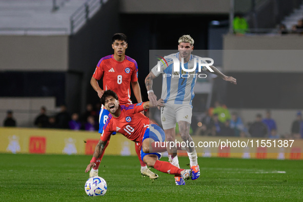 Victor Davila of Chile and Rodrigo de Paul of Argentina are in action during the FIFA World Cup 2026 Qualifier match between Argentina and C...