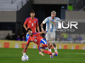 Victor Davila of Chile and Rodrigo de Paul of Argentina are in action during the FIFA World Cup 2026 Qualifier match between Argentina and C...