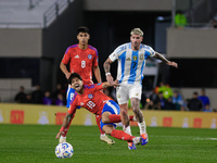 Victor Davila of Chile and Rodrigo de Paul of Argentina are in action during the FIFA World Cup 2026 Qualifier match between Argentina and C...