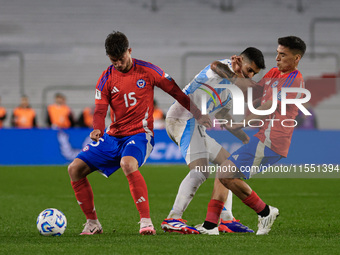 Felipe Loyola of Chile and Cristian Romero of Argentina are in action during the FIFA World Cup 2026 Qualifier match between Argentina and C...