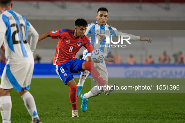 Dario Osorio of Chile and Lautaro Martinez of Argentina are in action during the FIFA World Cup 2026 Qualifier match between Argentina and C...