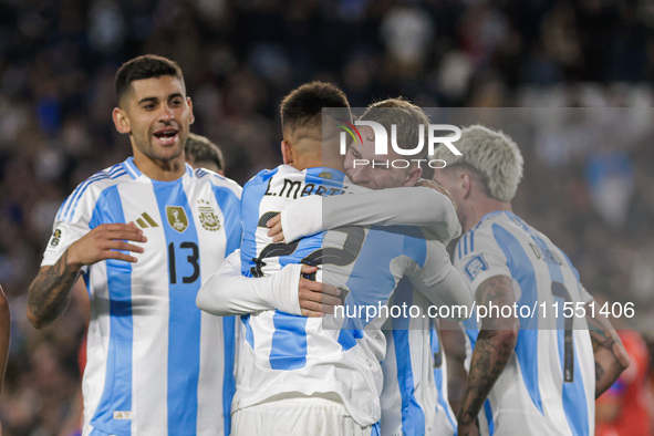 Alexis Mac Allister and Lautaro Martinez of Argentina celebrate after scoring the first goal of their team during the FIFA World Cup 2026 Qu...