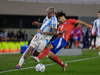 Rodrigo de Paul of Argentina and Victor Davila of Chile are in action during the FIFA World Cup 2026 Qualifier match between Argentina and C...