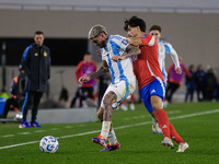 Rodrigo de Paul of Argentina and Victor Davila of Chile are in action during the FIFA World Cup 2026 Qualifier match between Argentina and C...