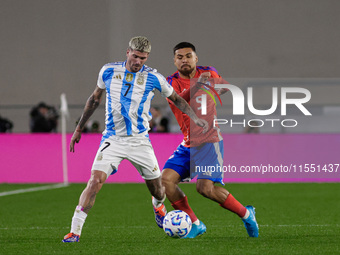 Rodrigo de Paul of Argentina and Paulo Diaz are in action during the FIFA World Cup 2026 Qualifier match between Argentina and Chile at Esta...