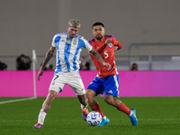 Rodrigo de Paul of Argentina and Paulo Diaz are in action during the FIFA World Cup 2026 Qualifier match between Argentina and Chile at Esta...