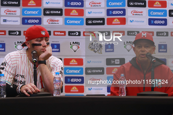 Julian Ornelas #31 and Lorenzo Bundy #30, manager of Diablos Rojos, speak during a press conference before match 2 between Sultanes de Monte...