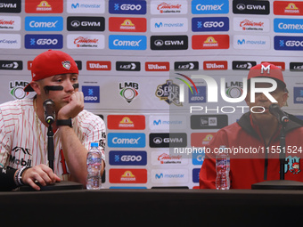 Julian Ornelas #31 and Lorenzo Bundy #30, manager of Diablos Rojos, speak during a press conference before match 2 between Sultanes de Monte...