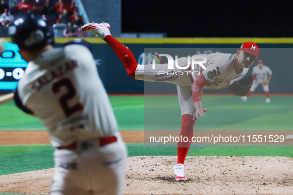 Erick Leal #49 of Diablos Rojos pitches the ball against Javier Salazar #2 of Sultanes de Monterrey during match 2 between Sultanes de Monte...