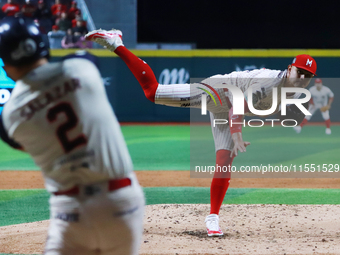 Erick Leal #49 of Diablos Rojos pitches the ball against Javier Salazar #2 of Sultanes de Monterrey during match 2 between Sultanes de Monte...