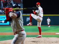 Erick Leal #49 of Diablos Rojos pitches the ball against Javier Salazar #2 of Sultanes de Monterrey during match 2 between Sultanes de Monte...