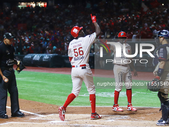 Aristides Aquino #56 of Diablos Rojos celebrates against Sultanes de Monterrey during the match between Sultanes de Monterrey and Diablos Ro...