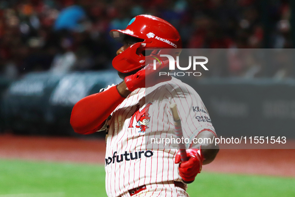 Jose Pirela #67 of Diablos Rojos breaks the bat after hitting the ball against Sultanes de Monterrey during match 2 between Sultanes de Mont...