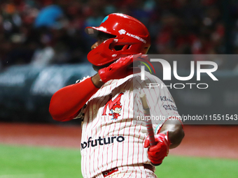 Jose Pirela #67 of Diablos Rojos breaks the bat after hitting the ball against Sultanes de Monterrey during match 2 between Sultanes de Mont...